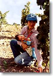 Young vines, Carol Perata and first child.